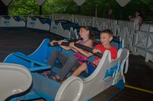 two children riding the himalaya circular ride